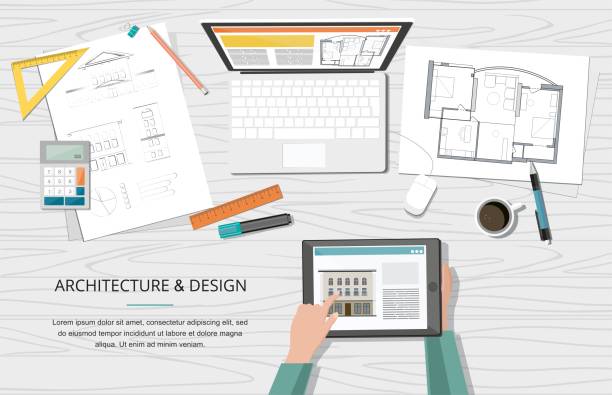 فضای کاری معمار با نقشه ها و لپ تاپ، نمادی از طراحی معماری