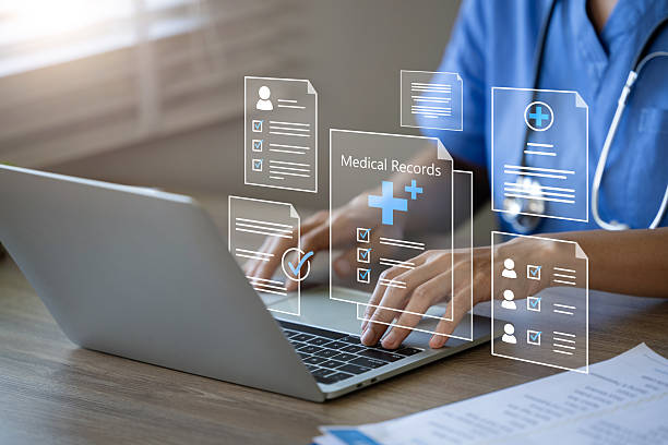 پزشک در حال استفاده از لپ تاپ برای مدیریت پروندههای پزشکی الکترونیکی - تجربه زیبایی فراشخصی در شیراز: راهنمای بهینهسازی تجربه کاربری (UX) با هوش مصنوعی برای سایت کلینیکهای پوست و مو و بهینهسازی تجربه کاربری (UX)