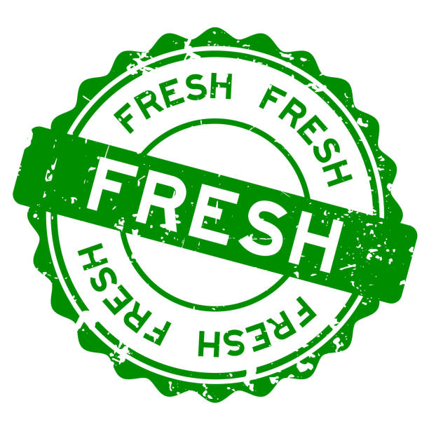 مهر سبز کلمه Fresh بر روی زمینه سفید - نماد تازگی و کیفیت محصول