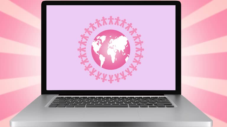 طراحی سایت پزشکی نوین برای مراکز ناباروری و IVF در مشهد: ارتقای UX بیماران و برندینگ دیجیتال در ۲۰۲۶ - انیمیشن لوگوی کره زمین صورتی روی صفحه لپ تاپ، نماد جهانی شدن و تکنولوژی دیجیتال در پزشکی