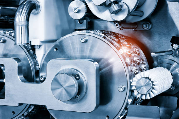 تصویر نزدیک از ماشین‌آلات صنعتی تولید بیسکویت و آبنبات - فرصت‌های فروش یاب برای خرید و فروش عمده و آگهی تجاری